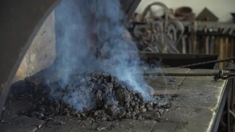 A Close-Up Look at the Process of Blacksmithing with Glowing Forge and Video stock 341316582