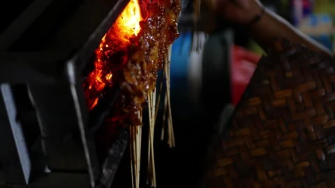 Close up look of Sate or satay, traditional food from Indonesia is being gr.. Stock Footage 294277659
