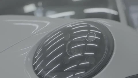 A Close-up Look at a Sleek Car Headlight Porsche Stock Footage 268716399
