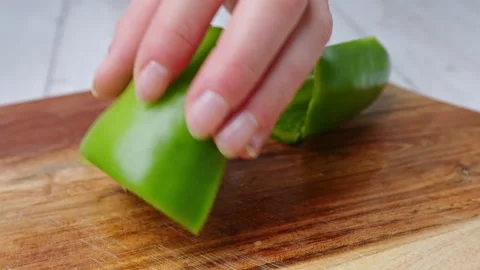 A close-up look of slicing and chopping a Green Bell Pepper on a cutting board. Stock Footage 142113460