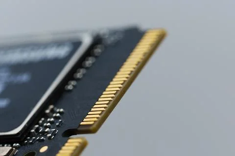 Close look at a solid state drive component with gold connectors Stock Photos