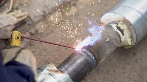 An Close Up Look at the Welding Process Featuring Sparks and Meticulous Metal Wo Stock Footage 287998415