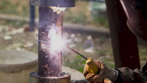 An Close Up Look at the Welding Process Featuring Sparks and Meticulous Metal Wo Stock Footage 287998843