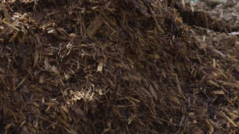 Close up look while panning left across a Mulch Pile. Stock Footage 336427050