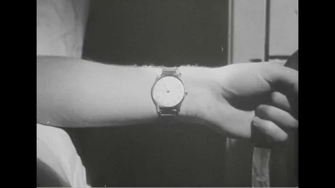 Close- up look of wristwatch on wrist and navy man try to sleep - 1945 Stock Footage 101407341