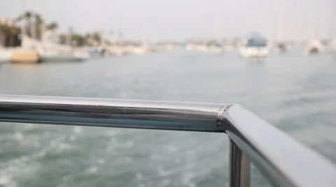 Close Up - Looking off the back railing of a moving boat Stock Footage 2165041