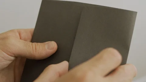 Close up - looking inside an envelope full of Israeli shekels (currency) Stock Footage 108581862