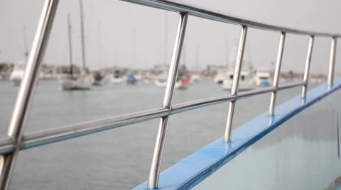 Close Up - Looking through the side railing of a moving boat Stock Footage 2164142