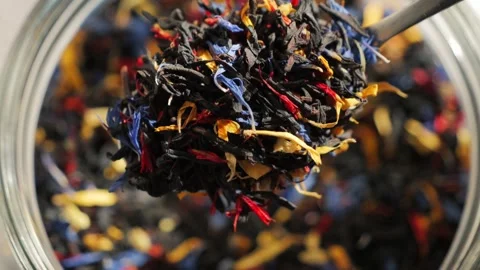 Close-up of loose leaf tea with large tea leaves and flower petals. Stock Footage 336385315