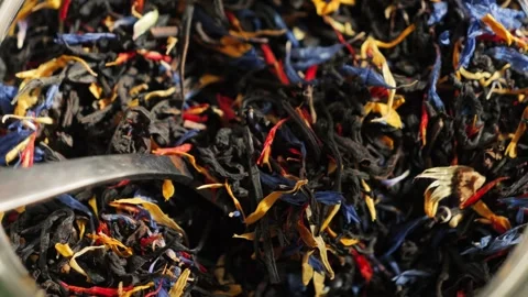 Close-up of loose leaf tea with large tea leaves and flower petals. Stock Footage 336395760