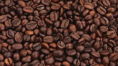 Close-up of a lot of coffee beans slowly rotating. Stock Footage 310655855