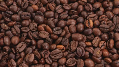 Close-up of a lot of coffee beans slowly rotating. Stock Footage 311154024