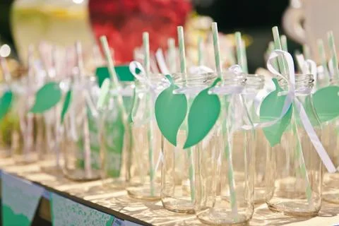 Close-up of a lot of empty bottles for lemonade or a cocktail with a striped  Stock Photos