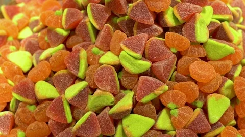 Close-up of a lot of red raspberry green marmalade candies n the candy store, fo Stock Footage 122761743
