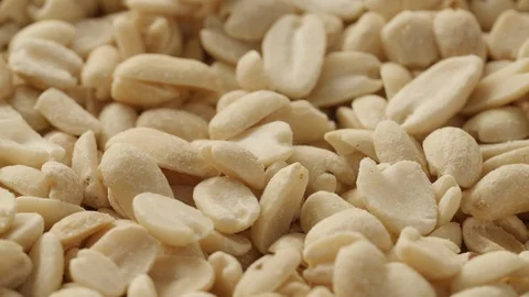 Close-up lot of roasted peanuts, slide camera movement from left to right Stock Footage 125338063