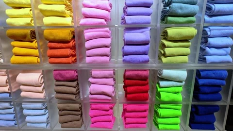 Close-up lots of new socks on the shelf in a clothing store. Видео 301436224