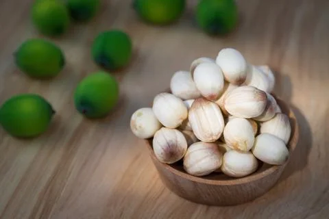 Close up lotus seed on small wooden cup Stock Photos