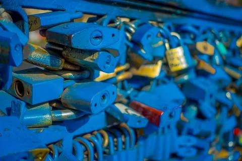 Close up of love locks padlocks chained to footbridge over the river mapocho 스톡 사진