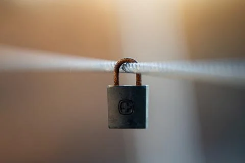 Close-Up of Love Padlock on Bridge Cable with Soft Background 스톡 사진
