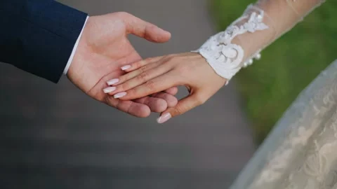 Close-up of lovers holding hands.  Tender moments between people Stock Footage 311443551