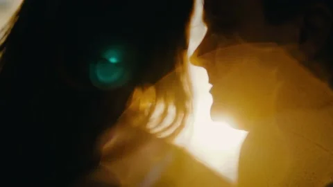 Close-up of lovers at sunset in the backlight. Sun glare shimmers in the lens Stock Footage 131579835