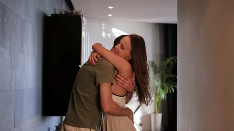 Close-up of a loving couple hugging and dancing in the evening at home Stock Footage 201830270