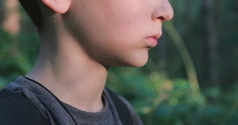 Close up low angle boy eating blackberry fruit Stock Footage 116130948