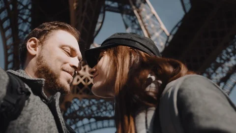 Close-up low angle happy smiling romantic couple kissing, looking at each other Stock Footage 121323145