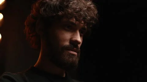 Close-up of low-angle shot of bearded young man having online video call via Stock Footage 146544165