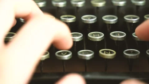 Close up,low angle shot of a man hand typing on a vintage typewriter, high light Stock Footage 149348039