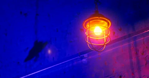 Close-up low angle shot of metal lantern swinging in different directions Stock Footage 220881535