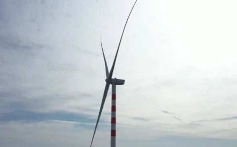 Close Up Low Angle Shot of Modern Wind Turbine Hub and Rotating Blades Against Stock Footage 342684235