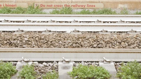 Close-up low angle side view of train passing on tracks in Italy Video stock 95493107