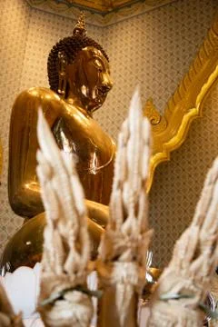 Close up low angle view of a golden buddha with dragons blurred on first sigh Stock Photos