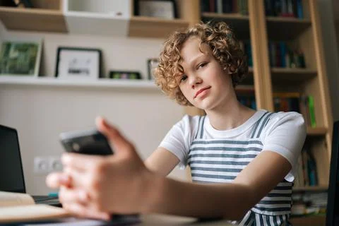 Close-up low-angle view of little schoolgirl pupil student e-learning, using Stockfoto's