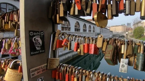 Close up low angle view of love lock padlocks. Ljubljana city Butcher's bridge Stock Footage 128144905