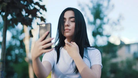 Close up low angle view of pretty good-looking stylish young woman taking photo Stock Footage 111219414