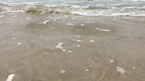 Close up, low angle view of ripple ocean waves, cloudy sky, rainy day. Stock Footage 155629871