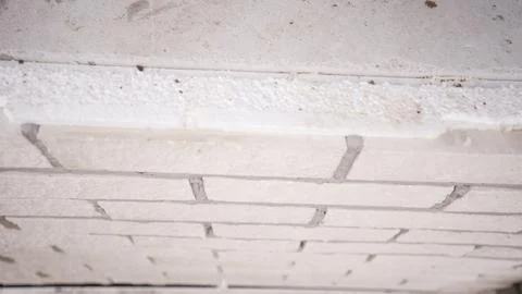 Close up, low angle view of an unfinished ceiling with white brickwork a raw  Stock Photos