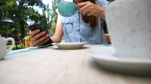 Close up Low Angle View of Young Woman Hands Using Phone in Cafe Stock Footage 109605380