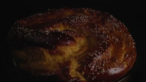 Close-up, Low Key, Fresh Home Bread Rotates on Turning Table Stock Footage 147698562