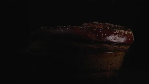 Close-up, Low Key, Home Fresh Bread Rotates Around the Axis on the Table Stock Footage 147403447