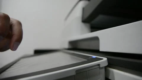 Close up low light. Someone work on modern copy machine at office. Stock Footage 132567085
