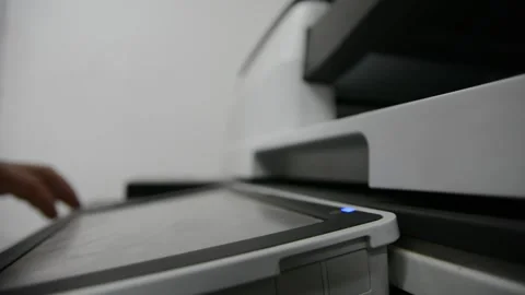 Close up low light. Someone work on modern copy machine at office. Stock Footage 132567114