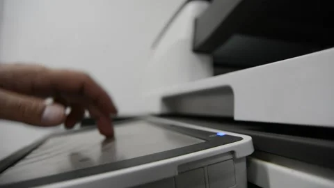 Close up low light. Someone work on modern copy machine at office. Stockbeeldmateriaal 132567177