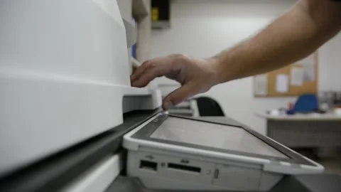 Close up low light. Someone work on modern copy machine at office. 스톡 동영상 132567182