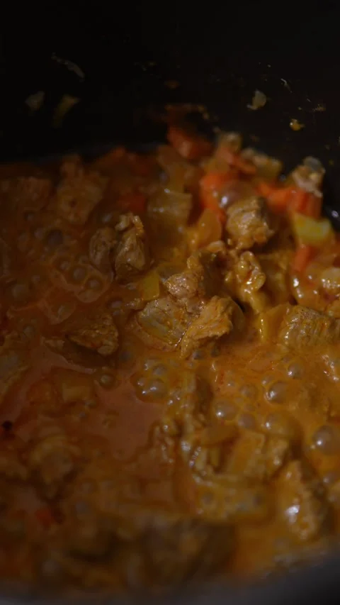 A close-up, low-light view of a rich orange-brown Stock Footage 328845285