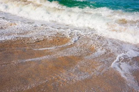 Close up of low tide at the sandy beach Stock Photos