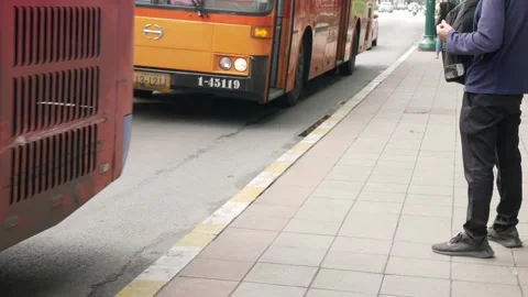 Close up lower angle view bus stop area public transportation when people p.. Stock Footage 231677676