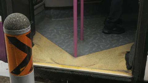 Close up lower angle view to the entrance automatic gate of the bus while arr Stock Footage 218363451